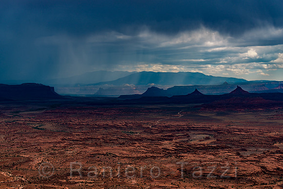 Rain in the distance on the Six Shooters buttes, Canyonlands, Utah