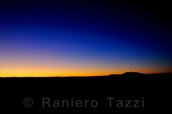 Dusk at Meteor Crater, with San Francisco Peaks in the distance - Arizona, Usa